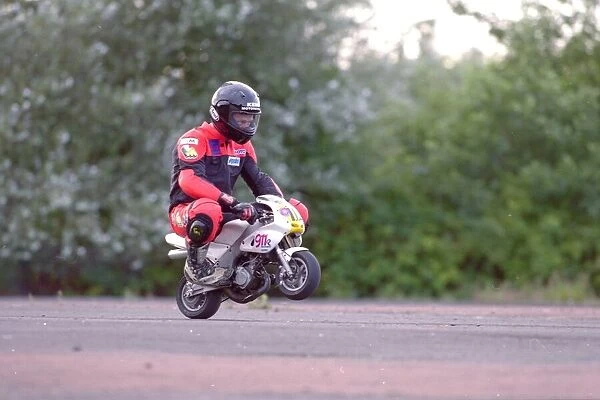 A rider on his mini-moto racing motorcycle