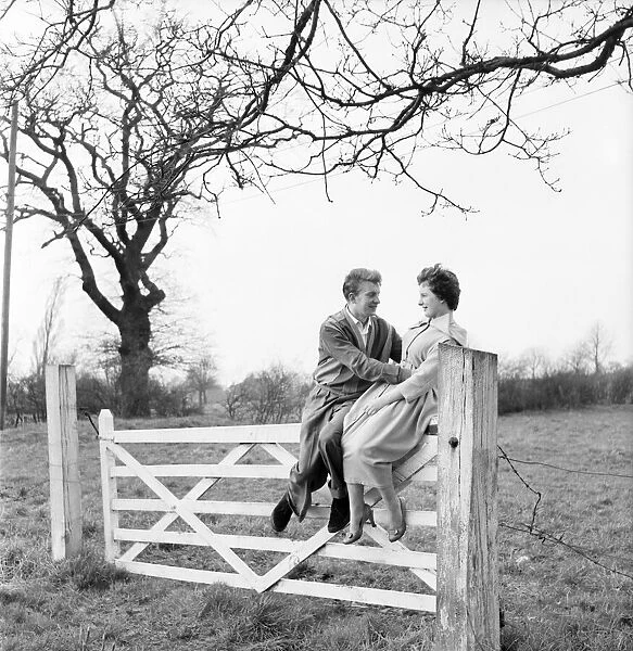 Romantic couple take a stroll in the country side. Richard Camp and Diane Ford. A651-005