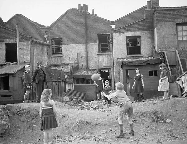 WW2 Children Playing Games Children playing games with a ball beside houses that
