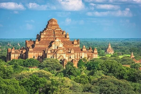 Bagan, Myanmar ancient temple ruins landscape with Dhammayangyi Temple in the archaeological zone at dusk