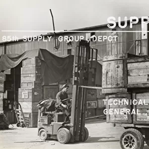 Airman Driving a Fork-Lift Truck with Wooden Crates Duri?