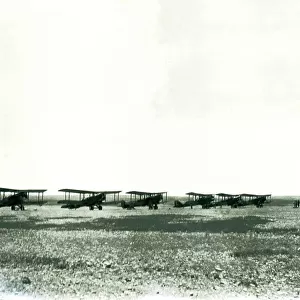 Six biplanes lined up in the desert, Iraq