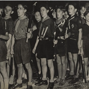 German boy scouts singing with torches