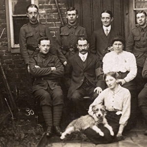 Group photo with soldiers and dog in yard