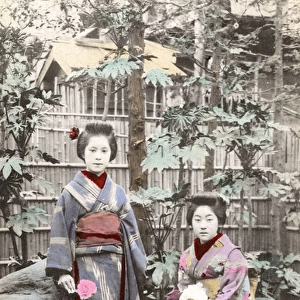 Two Japanese Geisha Girls wearing Kimonos