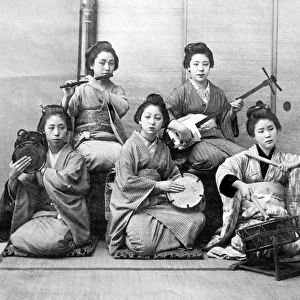 Japanese women playing on samisen, fuye, taiko, and tsuzumi