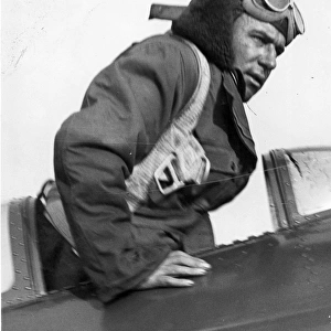 Jim Mollison leaving the cockpit of his Bellanca Flash