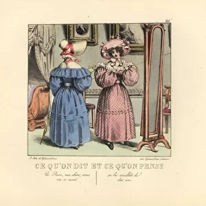 Two ladies dressing before a mirror in a parlor