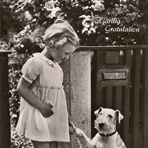 Little girl and dog on a greetings postcard, Sweden