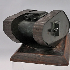 Metal model of WW1 tank on wooden base