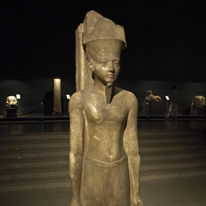Statue of god Amun with factions of the Pharaoh Tutankhamun