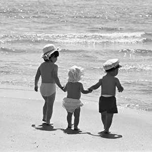 Three tots on beach, Tenby