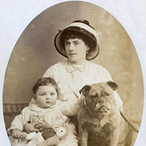 Woman with baby and dog in studio photo