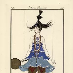 Woman in a blue pagoda dress with necklaces and pantaloons