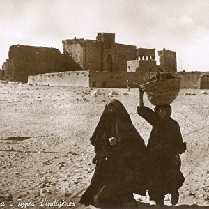 Women in front of the site of Palmyra, Syria