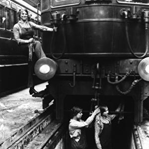 Three women working on a train carriage