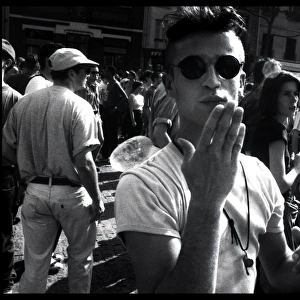 Young man blowing a kiss at a demonstration, Paris, France