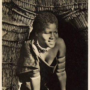 Young Zulu child, South Africa - Coming out of hut - morning