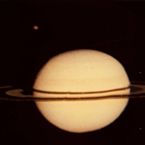 Pioneer 11 Image of Saturn and its Moon Titan