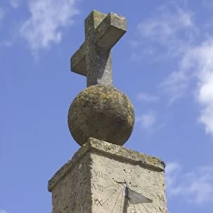 Sundial on medieval cross in Cotswold village of Stanton, Britain, UK