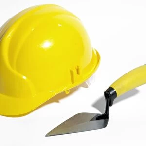 Bricklayers hard hat and trowel
