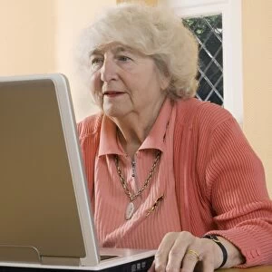 Elderly woman using a laptop computer