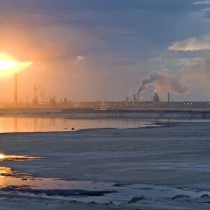 Oil refinery near sunset