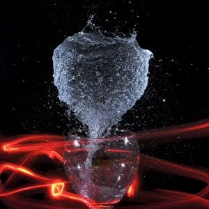 Water erupting out of a glass