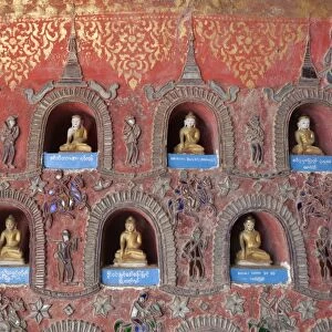 Buddha offerings in wall niche, Shwe Yan Pyay monastery, Nyaungshwe, Inle Lake, Shan State, Myanmar (Burma), Asia