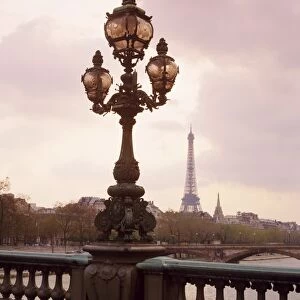 The Eiffel Tower seen from the Pont Alexandre III at dusk, Paris, France