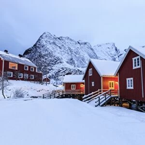 Fresh snow on the typical Norwegian homes, the Rorbu, once fishermens home, now tourist accommodation, Lofoten Islands, Arctic, Norway, Scandinavia, Europe