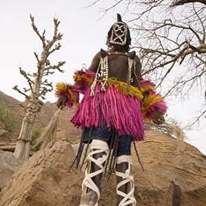 Masked ceremonial Dogon dancer on stilts near Sangha, Bandiagara escarpment