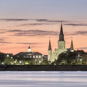 New Orleans skyline, view of Saint Louis Cathedral from across the Mississippi River at sunset