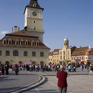 Piata Sfatului, the centre of medieval Brasov, Council House (Casa Sfatului) dating from 1420 topped by a Trumpeters Tower, and old city hall now housing the Brasov Historical Museum, Brasov, Transylvania