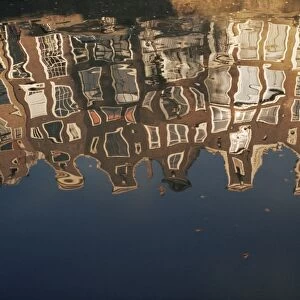 Reflection of buildings in water of a canal