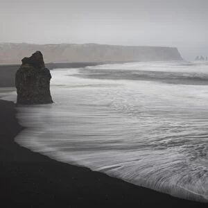 Reynisdrangar basalt rock columns and black sand beach in Vik, Iceland, Polar Regions