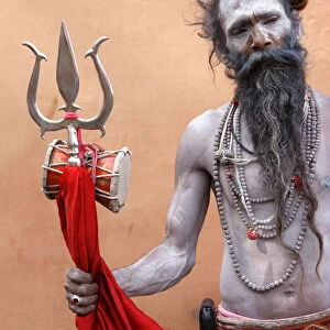 Sadhu with Shiva trident attending Haridwar Kumbh Mela, Haridwar, Uttarakhand, India
