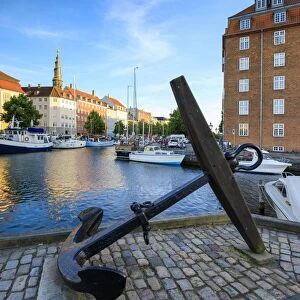 Sculpture of an anchor on the banks of Christianshavn Canal with Church of Our Saviour