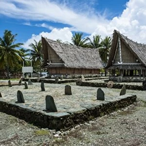 Traditional house with stone money in front, Island of Yap, Federated States of Micronesia, Caroline Islands, Pacific