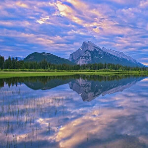 Clouds and Mt. Rundle reflected in Vermillion Lakes at sunrise, Banff National Park, Alberta, Canada
