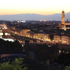 Florence, Tuscany, Italy. View over the Arno river, Ponte Vecchio, the Duomo cathedral