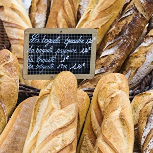 Fresh bread sold at the local market in Colmar, Alsatian Wine Route, France