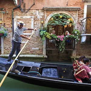 Italy, Veneto, Venice, Sestiere of Rialto, Gondola and small canal