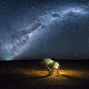 Tourist camping outdoor admiring the stars of the Southern Hemisphere, Namibia, Africa