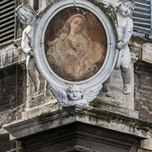 Traditional Madonnella or Madonna painting placed in a buildings corner, Rome, Lazio