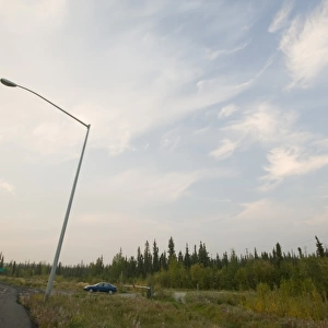 A lamp post in Fairbanks Alaska collapsing into the ground due to global warming induced permafrost melt