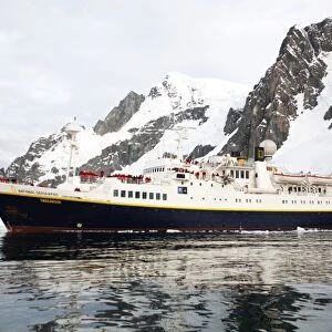 The National Geographic Endeavour pushing through brash ice and small icebergs in the Lemaire Channel near the Antarctic Peninsula