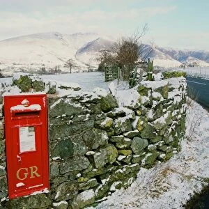 A winter post box in St Johns in the Vale in the Lake District UK
