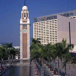 CHINA, Hong Kong, Kowloon Kowloon Star ferry clock tower at end of rectangular pool