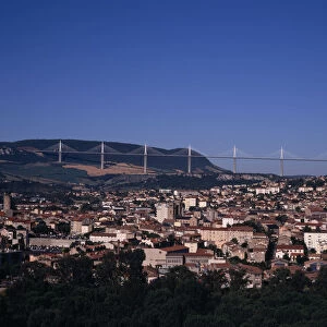 FRANCE, Midi-Pyrenees, Aveyron Millau. Cityscape with Millau bridge beyond which